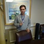 Stuart takes a moment for a picture at the office