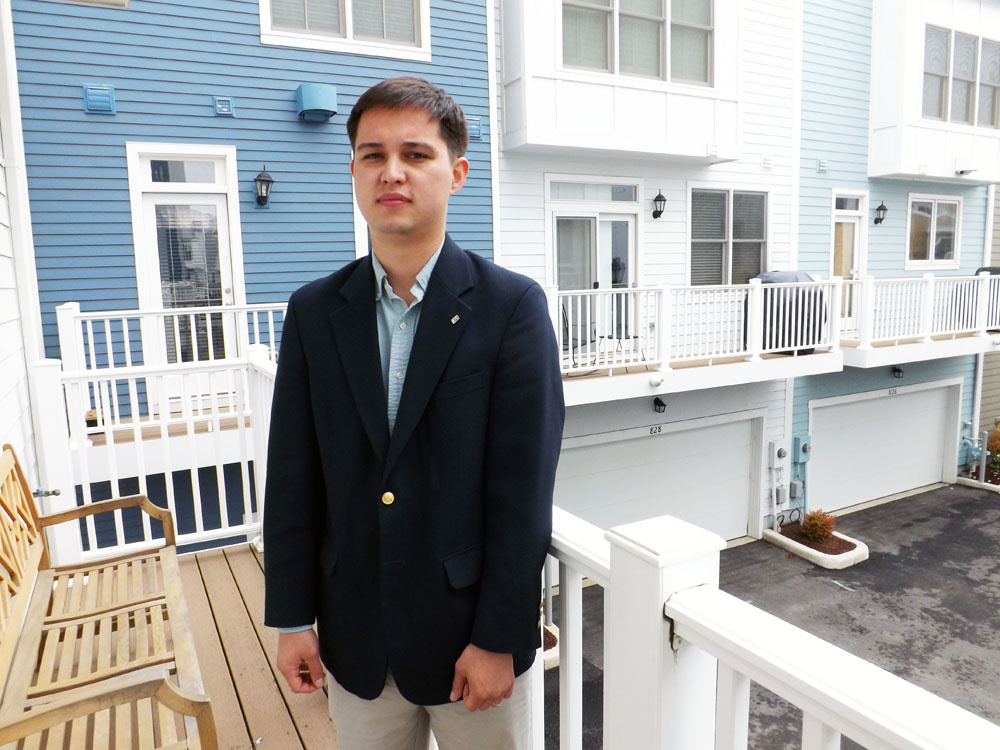 Stuart Nesbitt standing on a balcony at Old Town Commons