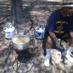 A gentleman fries some food at Pohick Regional Park