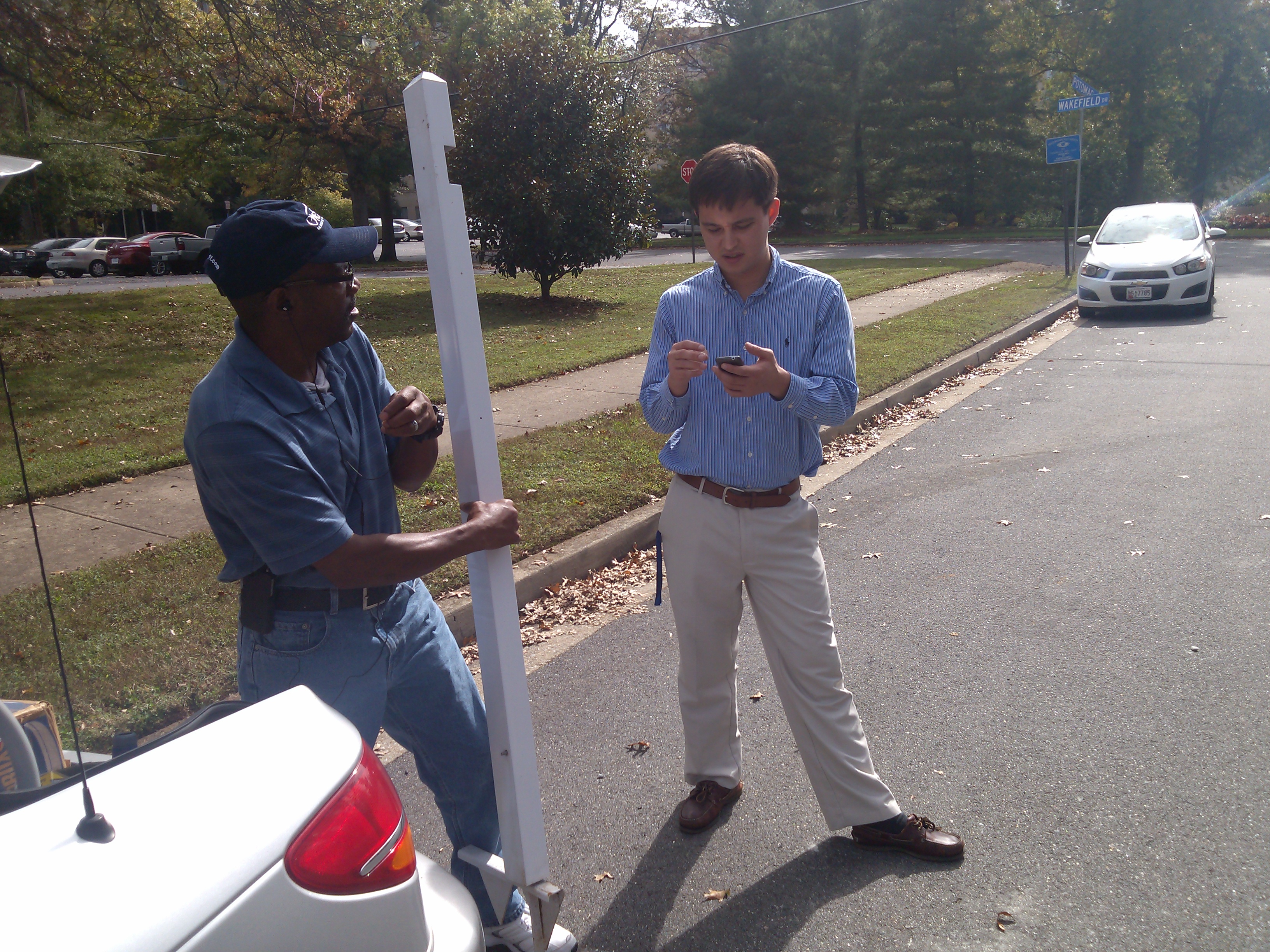 Realtor Stuart Nesbitt chats with a handyman