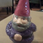 A custom painted garden gnome at Paint This! Ceramics Studio in Old Town