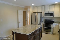 A single family homes at 7211 Sydenstricker Rd Springfield VA 22152