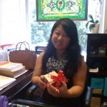 Smiling with a present, yet to be opened