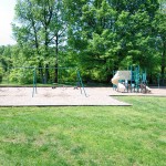 Tot lot near a grass lawn