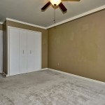 This bedroom has a ceiling fan