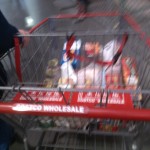 Will Nesbitt guides Aubrey Nesbitt's grocery cart loaded with food