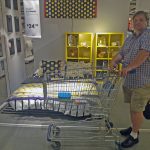 Will Nesbitt, Principal Broker eyeballs furniture in Woodbridge