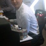 Seated Stuart Nesbitt, Real Estate Agent works on leads