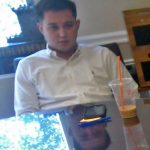 Stuart Nesbitt, Realtor cell phone on table and Baskin Robins / Dunkin Donuts melted ice coffee during meeting